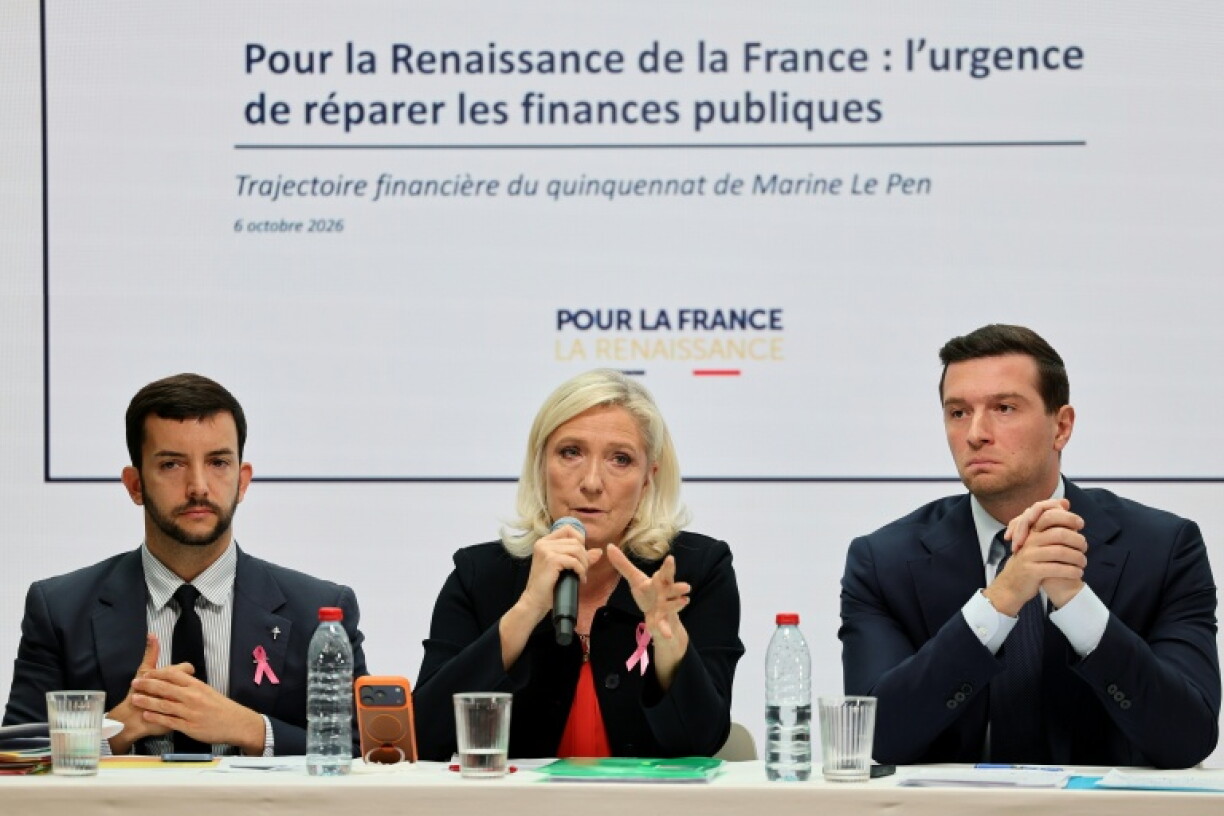 Far-right candidate Marine Le Pen, centre, has vowed steep spending cuts if elected next spring