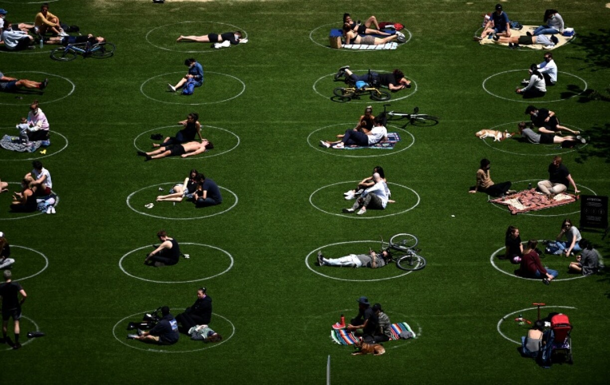 The Trump administration is blaming a Chinese lab for the Covid-19 pandemic outbreak that took millions of lives and forced communities to social distance to prevent its spread, as seen here in a park in New York City in May 2020