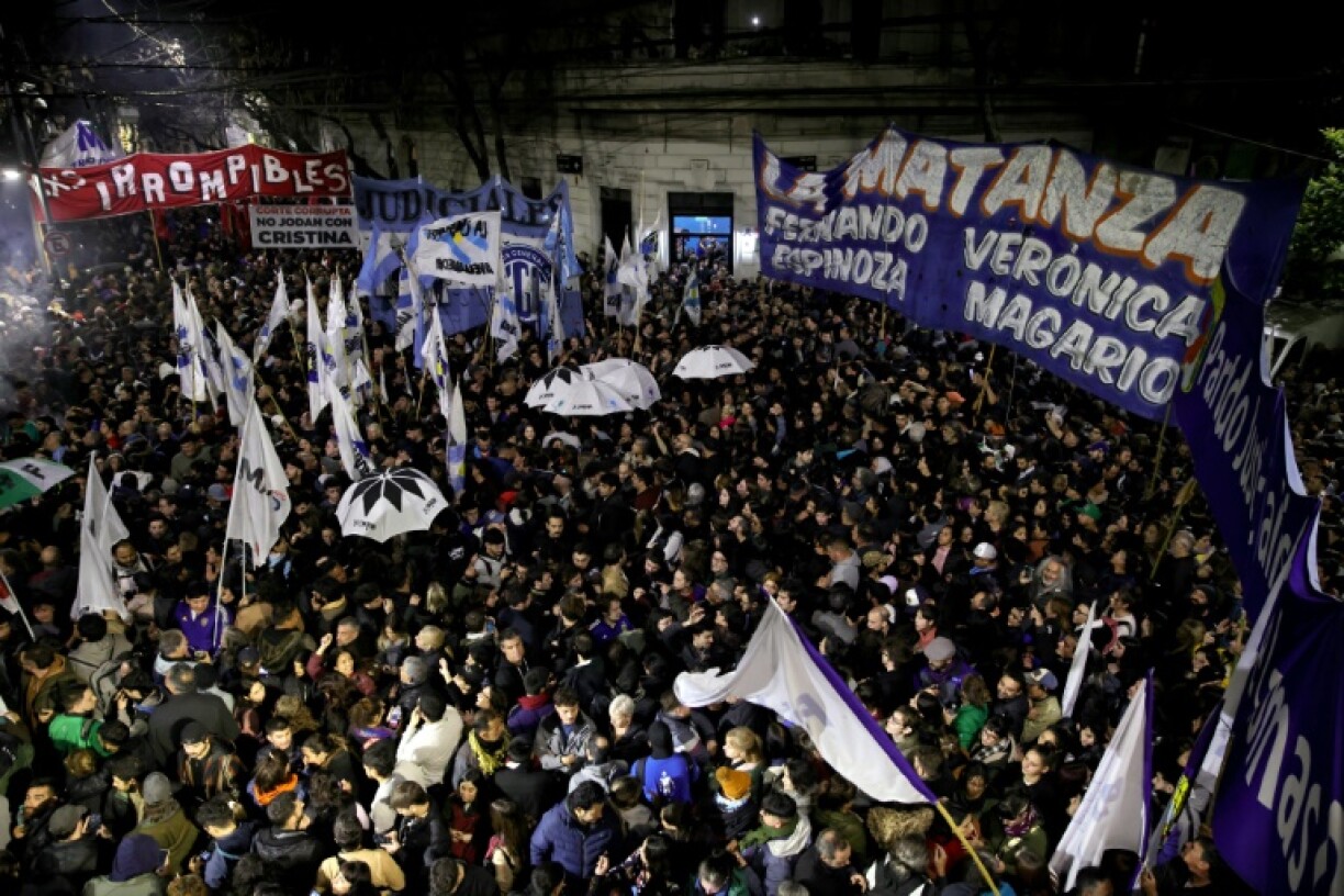 Supporters of Argentina's former president Cristina Kirchner gather outside her home in Buenos Aires after Argentina's Supreme Court upheld her fraud conviction