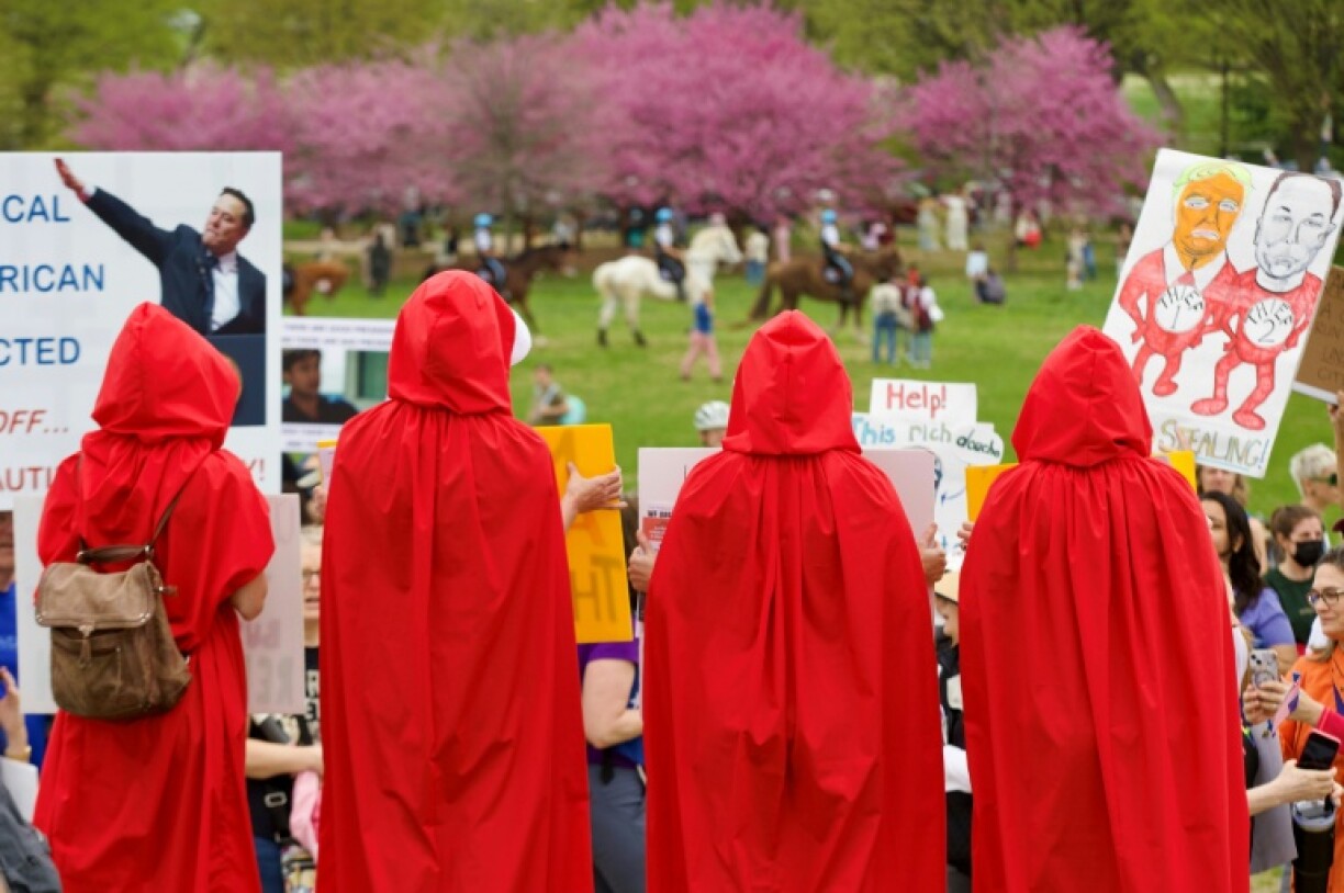 Demonstrators dressed as characters from 'The Handmaid's Tale' gather on the National Mall for the nationwide