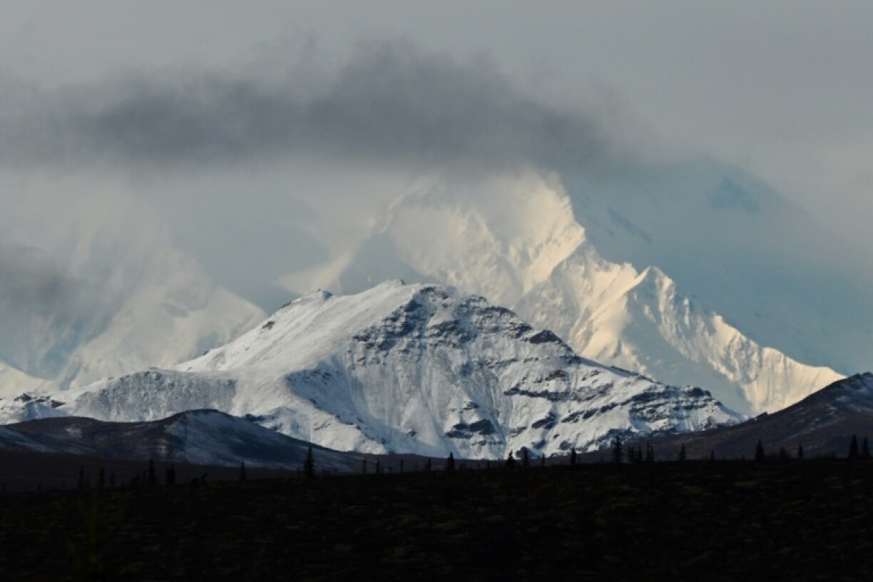 Clouds partially obscure Denali, the highest mountain peak in North America, as seen from inside Denali National Park, Alaska, on September 22, 2022