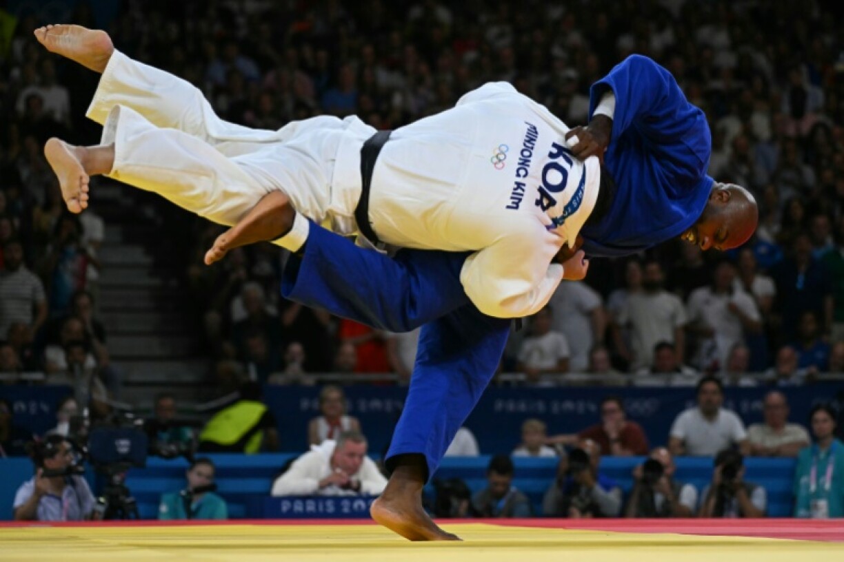 France's Teddy Riner (Blue) in action at the Paris Olympics