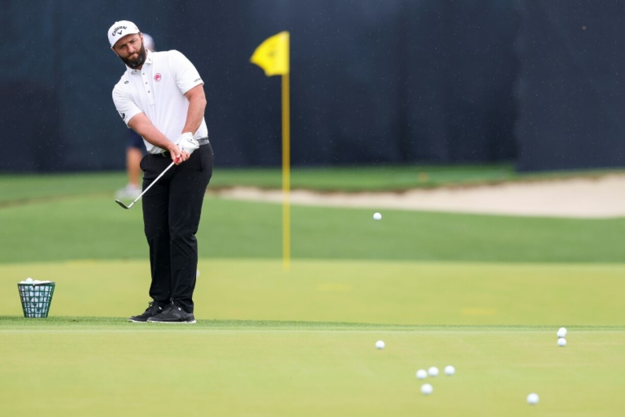 Spain's Jon Rahm chips onto the practice green ahead of the 107th PGA Championship at Quail Hollow