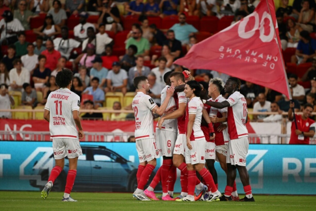 Monaco players celebrate Eric Dier's (C) goal against Le Havre at the Louis II Stadium
