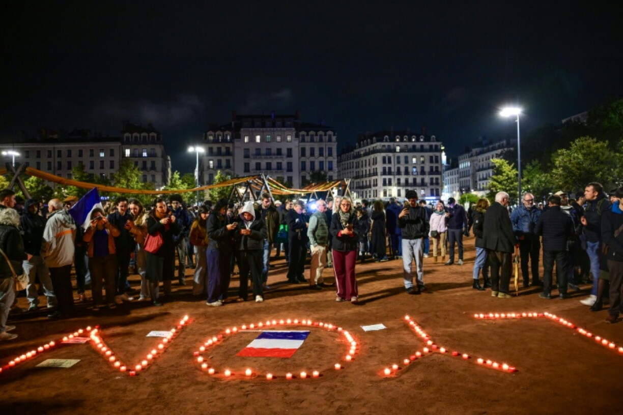 In Lyon, around 500 people gathered on Monday evening outside the tourism office that was set on fire
