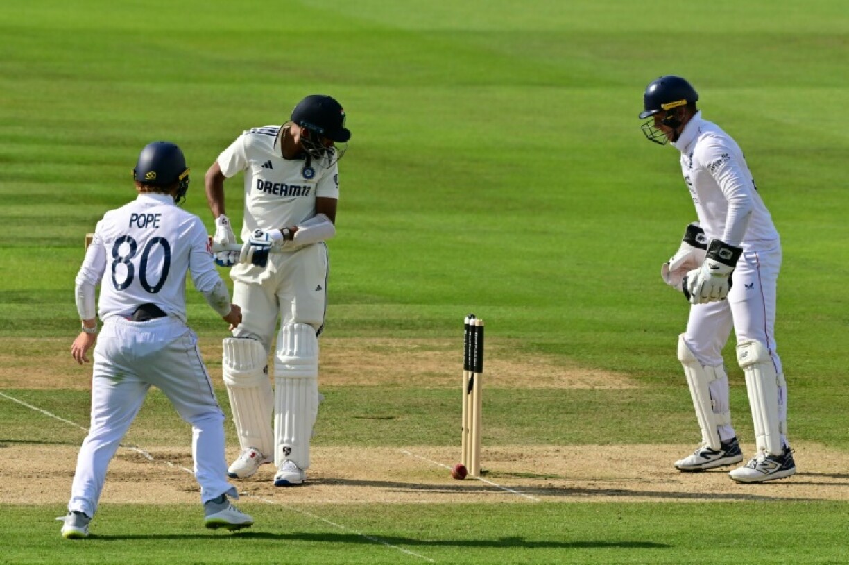 India's Mohammed Siraj (2L) can only watch as a ball from Shoaib Bashir spins back onto his stumps as Ollie Pope (L) and Jamie Smith (R) look on, as England win the third Test at Lord's by 22 runs