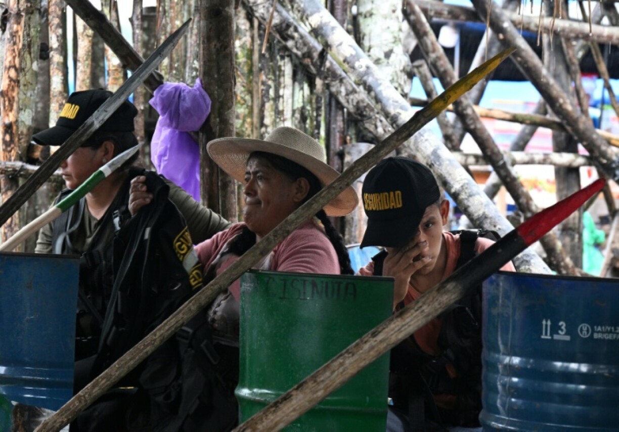 Peasants loyal to former Bolivian president Evo Morales stand guard with wooden spears at the gates of Lauca Ene