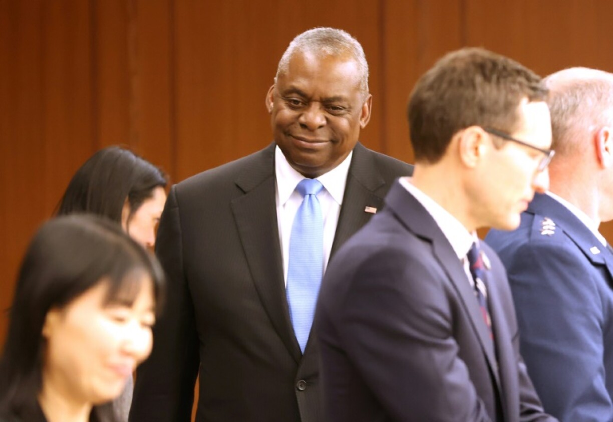 US defence chief Lloyd Austin (C) is in Tokyo on what will likely be his last official Asia-Pacific trip