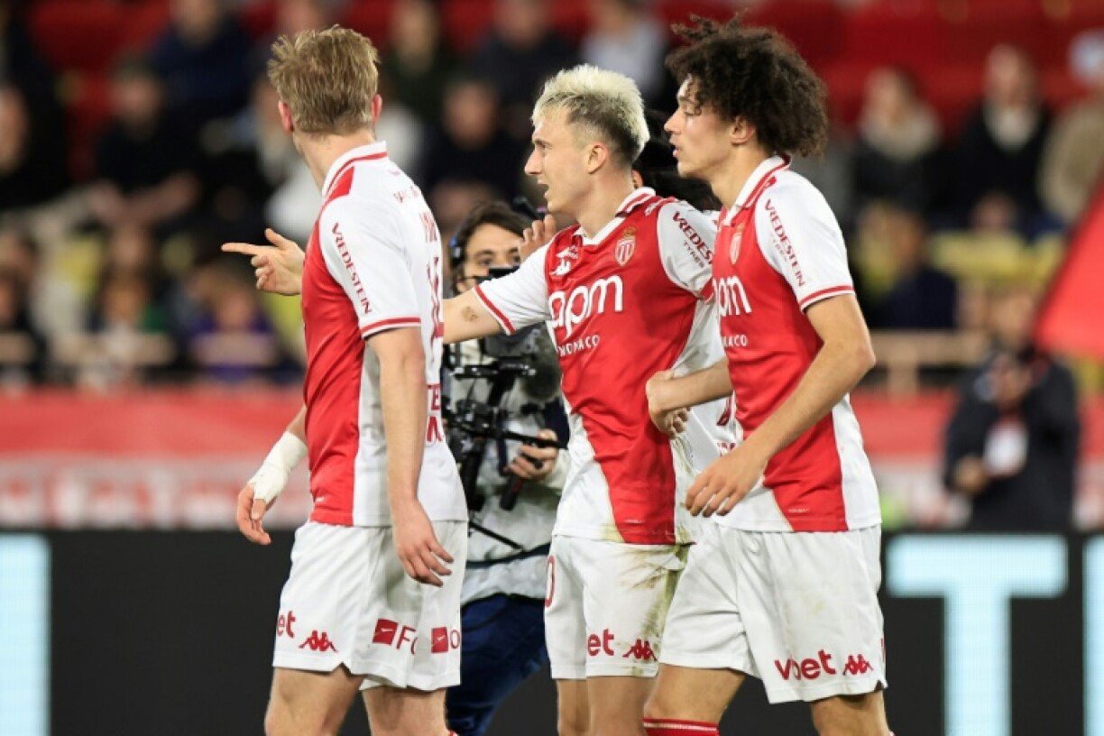 Aleksandr Golovin (C) celebrates after scoring Monaco's third goal in their win against Rennes