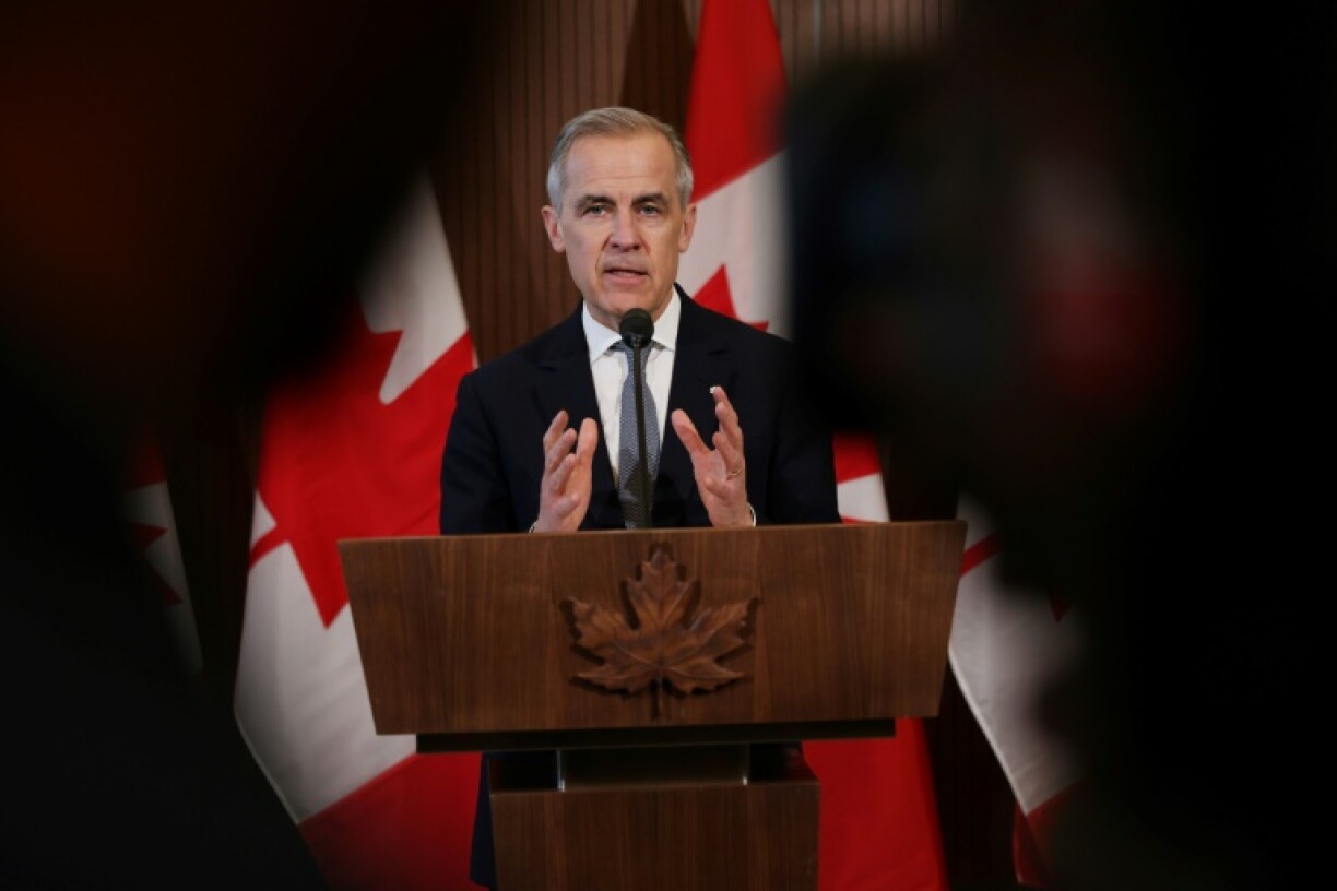 Canada's Prime Minister Mark Carney speaks to the media after meeting with his cabinet to deal with the US auto tariffs on March 27, 2025