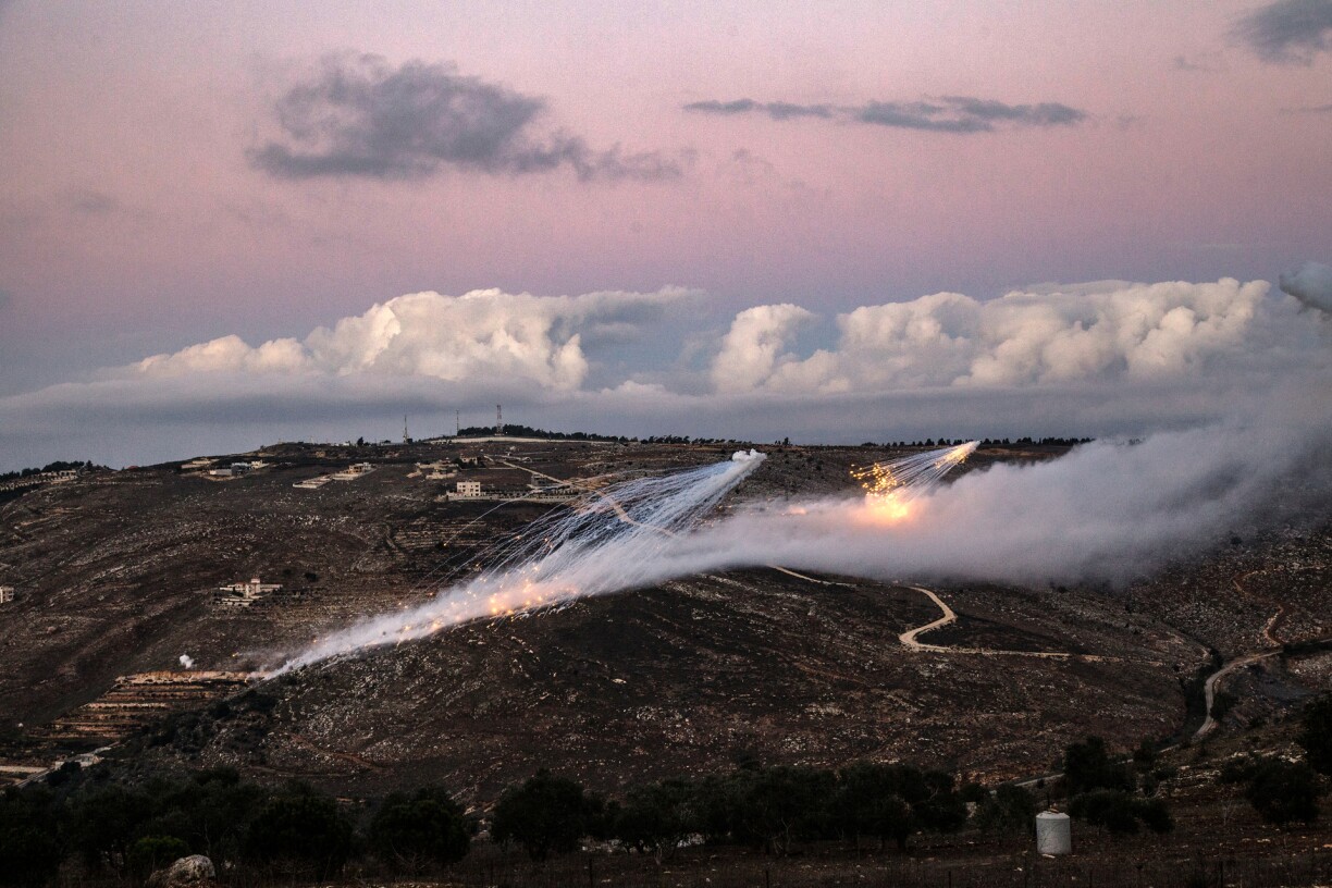 Artillery fire from an Israeli position hits the hills near the outskirts of the border town of Odaisseh in southern Lebanon on November 17, 2023.