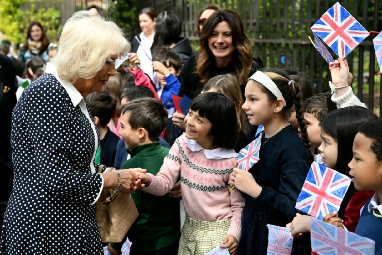 Britain's Queen Camilla greets children as she visits the Alessandro Manzoni school as part of a state visit in Rome