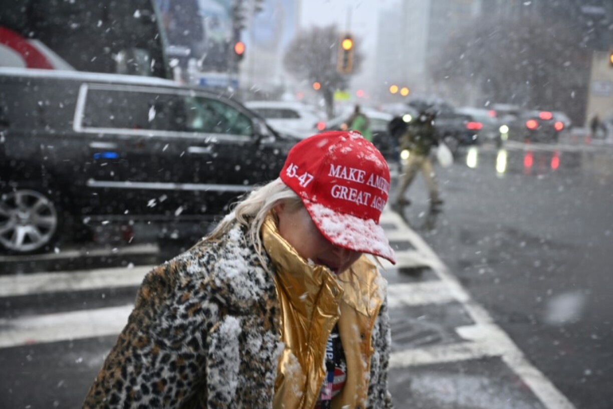 Snow fell as thousands remained in line to see US President-elect Donald Trump speak at victory rally in Washington on Sunday