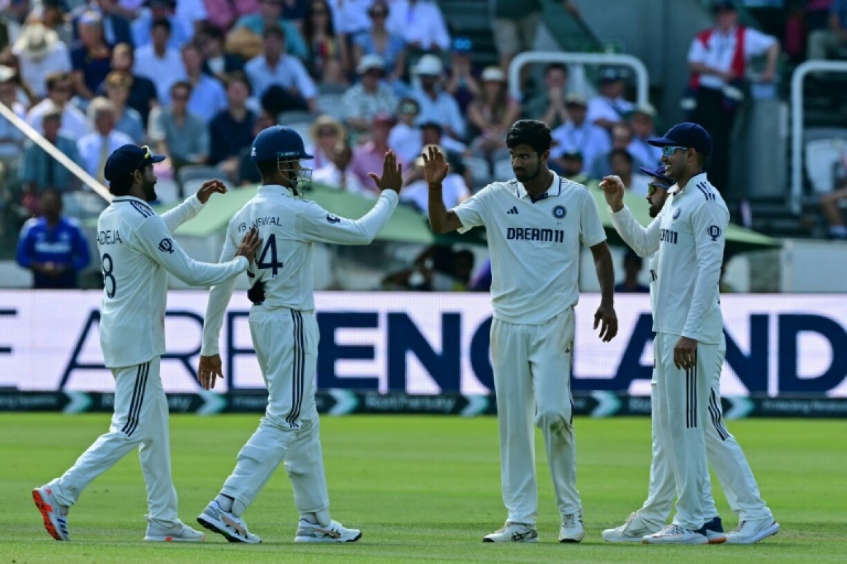 India's Washington Sundar (C) celebrates with team-mates after bowling Jamie Smith in the third Test against England at Lord's