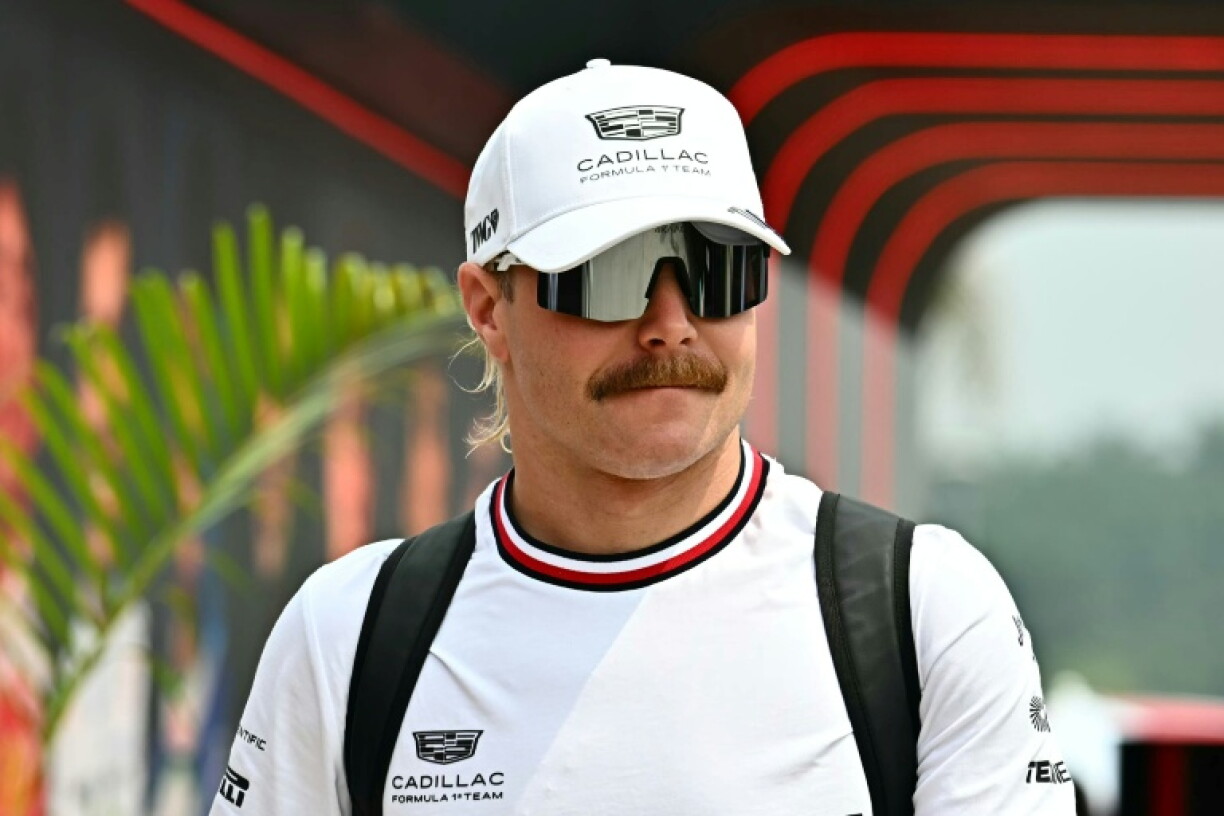 Cadillac's Finnish driver Valtteri Bottas arrives ahead of the Formula One Bahrain Grand Prix in Sepang on Sunday. He left on a bike to ride to Singapore