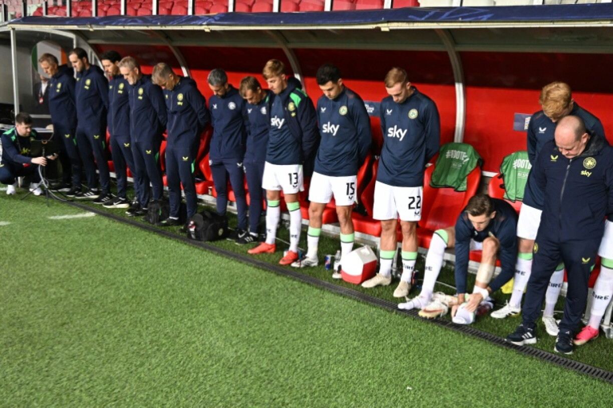Ireland's players came out for the match in Hungary wearing black armbands and bowed their heads as the Israeli national anthem was played
