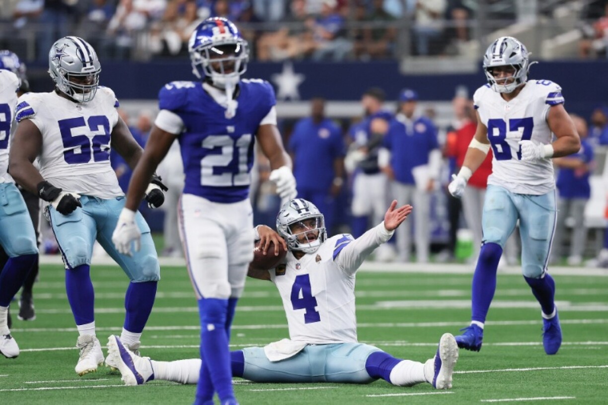 Dallas quarterback Dak Prescott reacts after sliding into field goal range in overtime in the Cowboys' NFL victory over the New York Giants