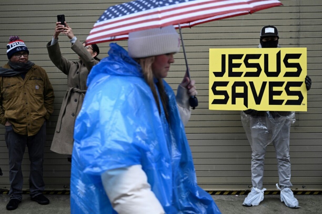 Many Trump supporters carried signs with Christian messages, with some preaching from the Bible using loudspeakers