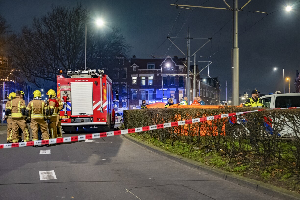 Emergency workers at the scene where a 14-year-old boy was killed by fireworks. The incident happened in the Watergeusstraat in Rotterdam's Delfshaven neighborhood.
