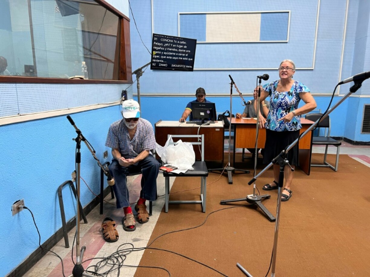 Actors of Cuban radio soap opera 'Amores en Subasta' record at the studio of Radio Progreso in Havana, as many Cubans forego modernities like the internet or streaming services and listen to the age-old medium of radio soap operas