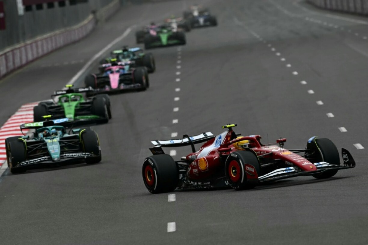 British driver Lewis Hamilton (R) said he was mystified by Ferrari's poor decisions and loss of pace