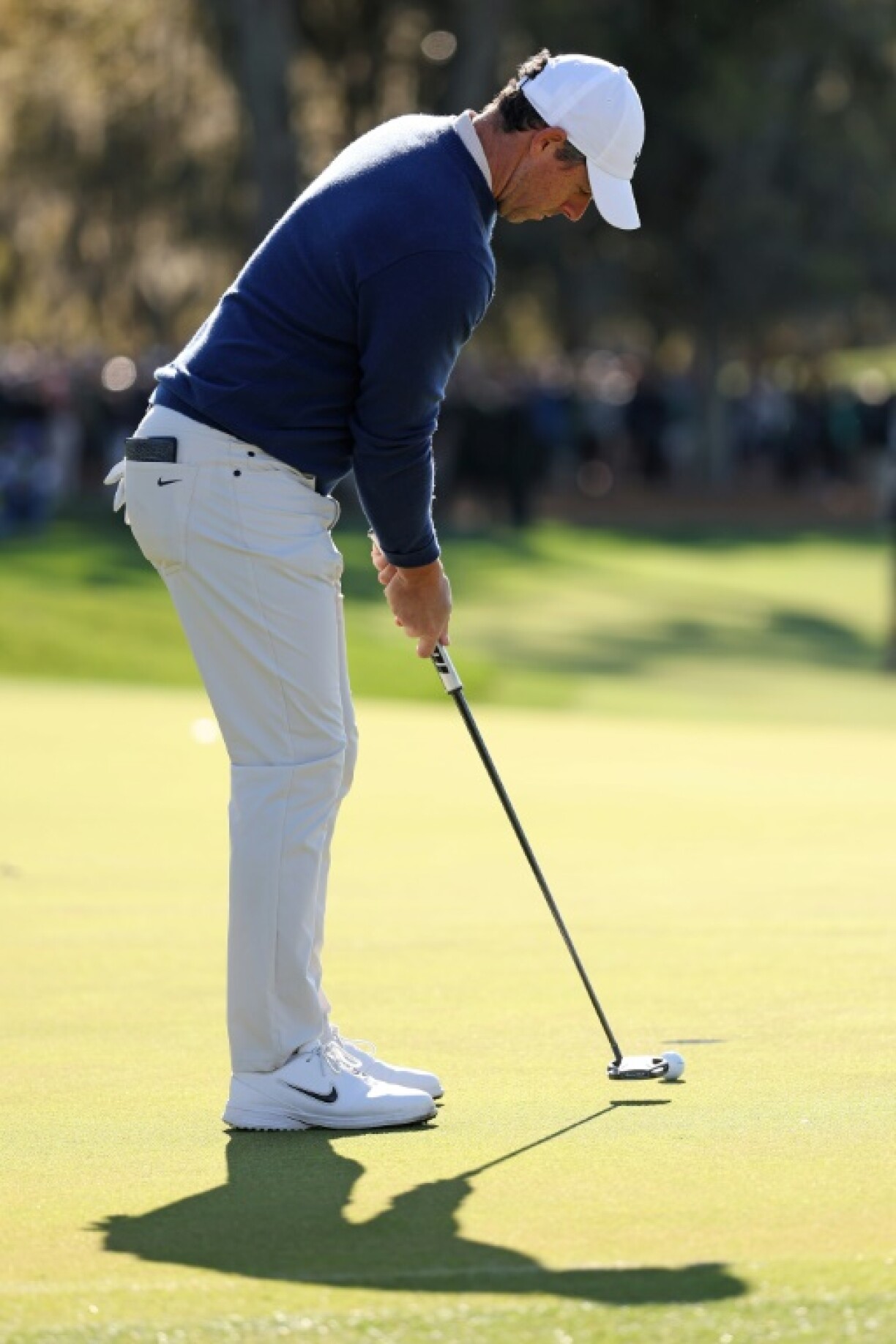 Rory McIlroy putts out to complete his Players Championship playoff win