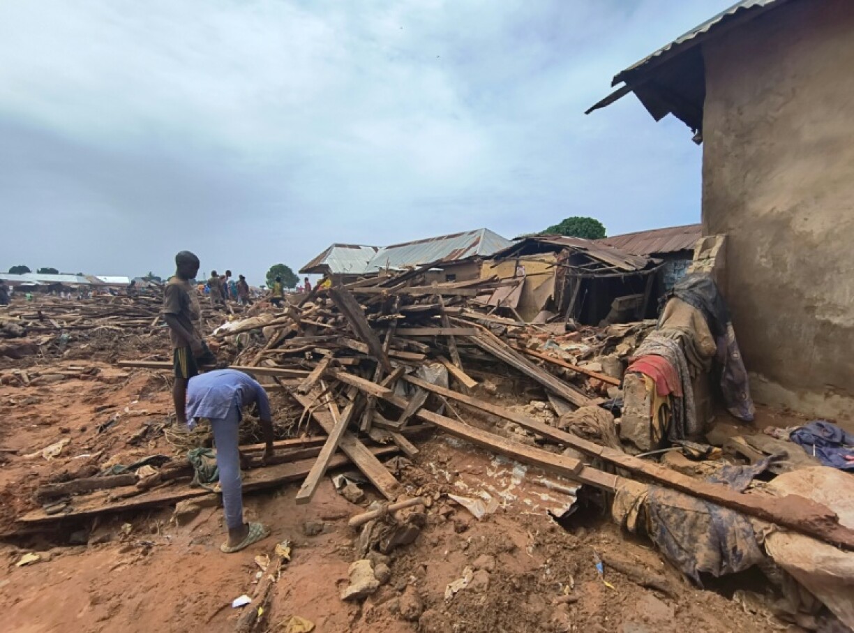 People picked through debris from damaged buildings in Mokwa