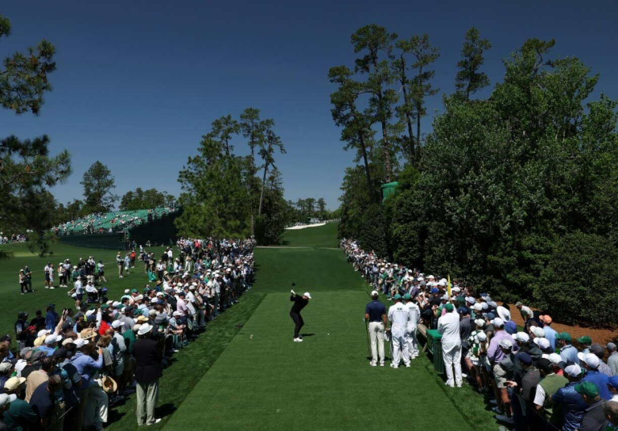 Rory McIlroy of Northern Ireland plays his shot from the 18th tee during a practice round prior to the 2025 Masters at Augusta National