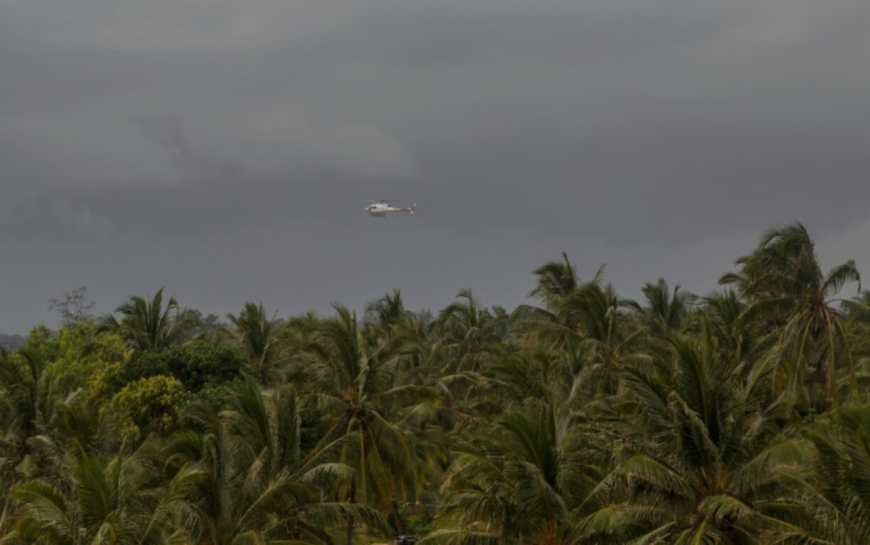 A helicopter flies over Pemba, Mozambique after deadly attacks by armed groups linked to Islamic State on March 30, 2021