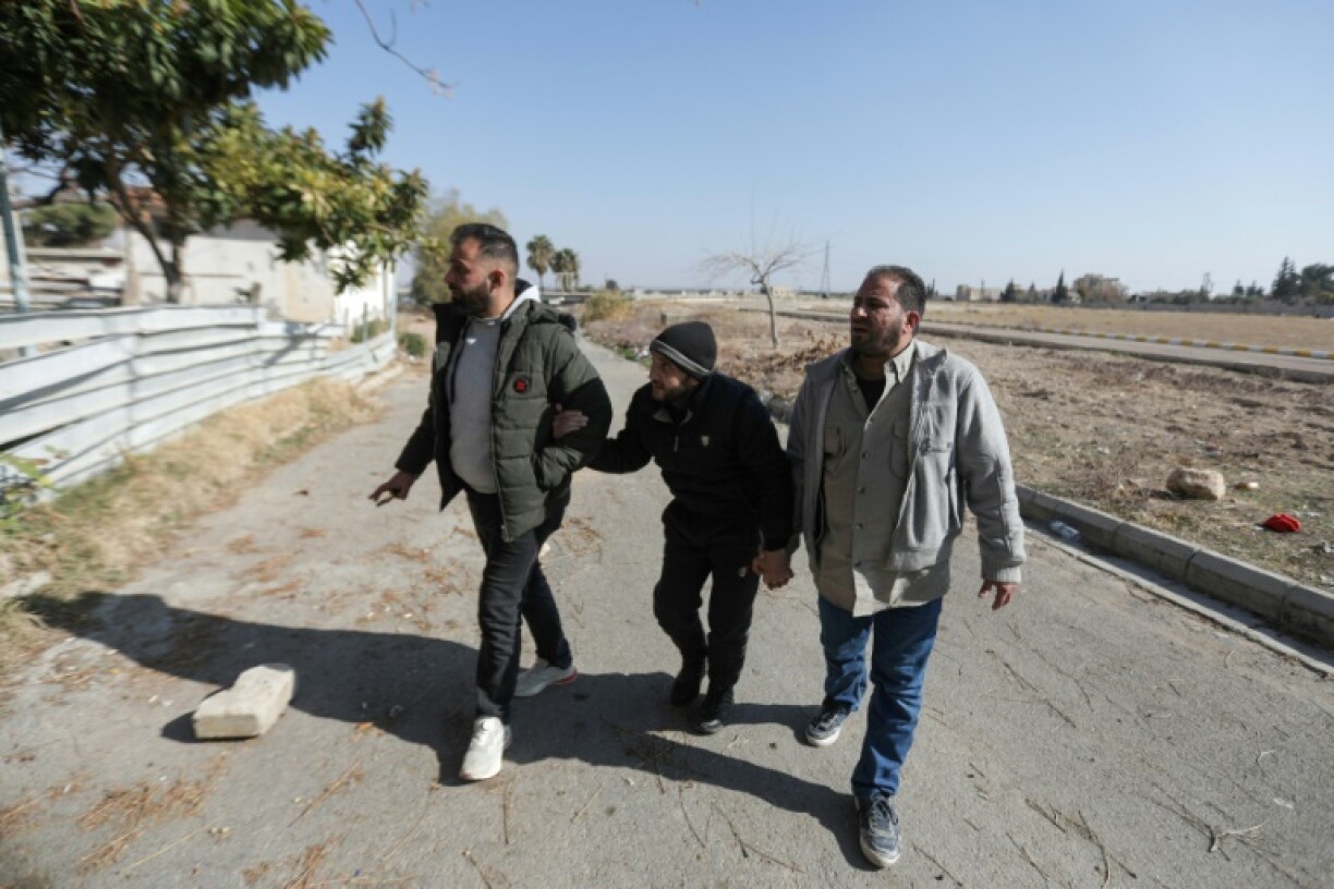 Former detainees Osama Abdul Latif, Mohammed Najib and Omar al-Masri revisit the Tishreen Military Hospital