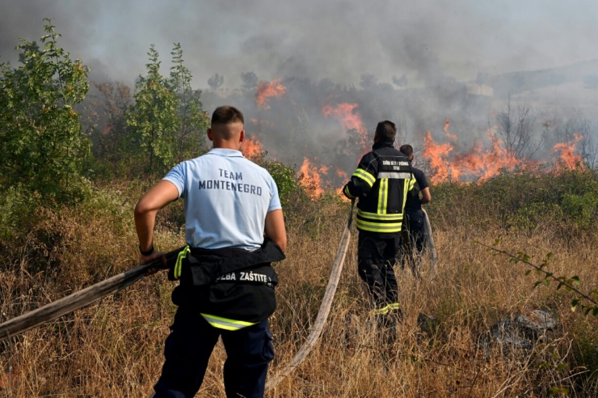 Just outside the capital of Montenegro, fire crews managed to save dozens of homes when a blaze broke out in 'extremely inaccessible terrain'