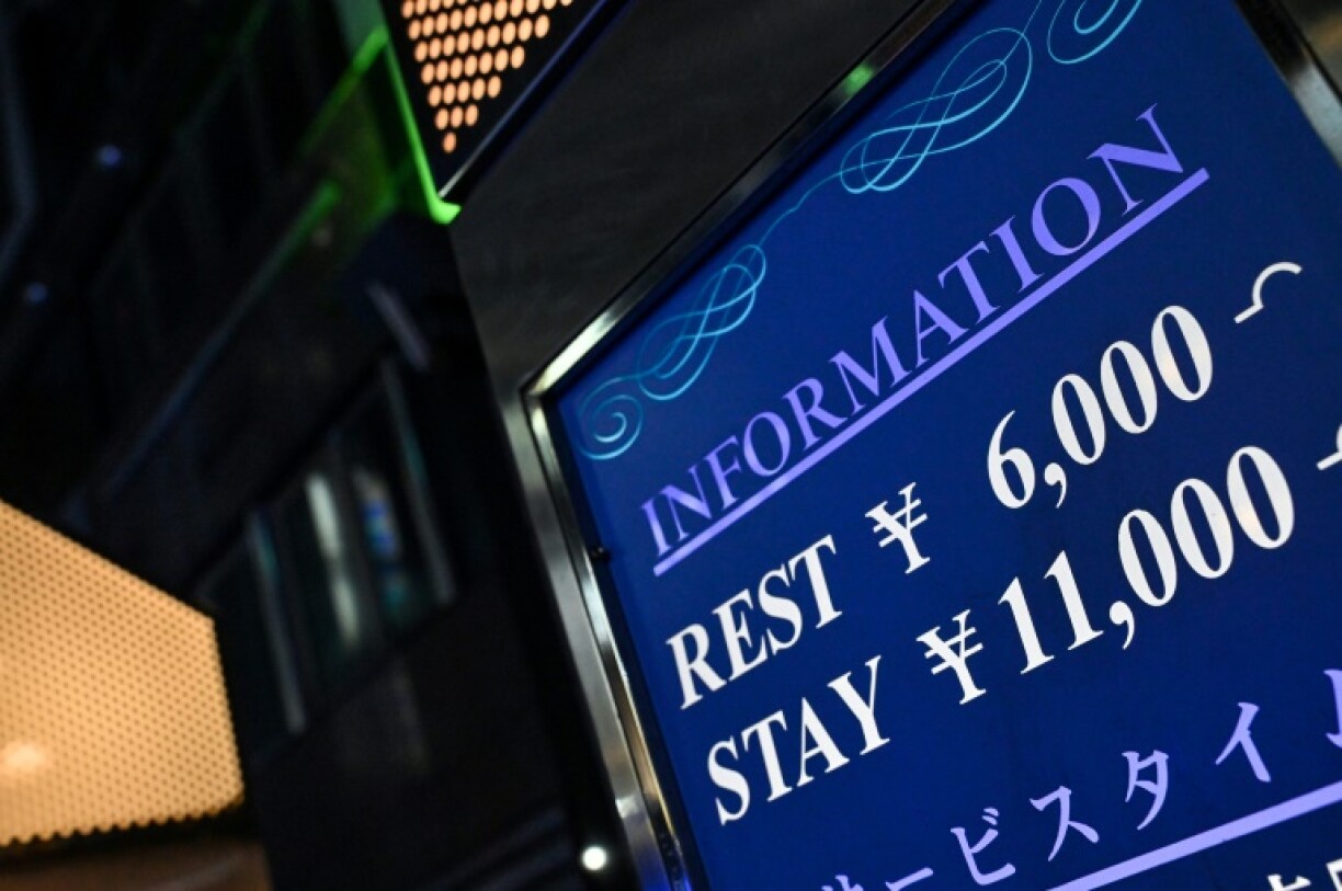 A sign outside a hotel offering short and long term (daily) rates, in the red-light entertainment area of Kabukicho in the Shinjuku district of Tokyo