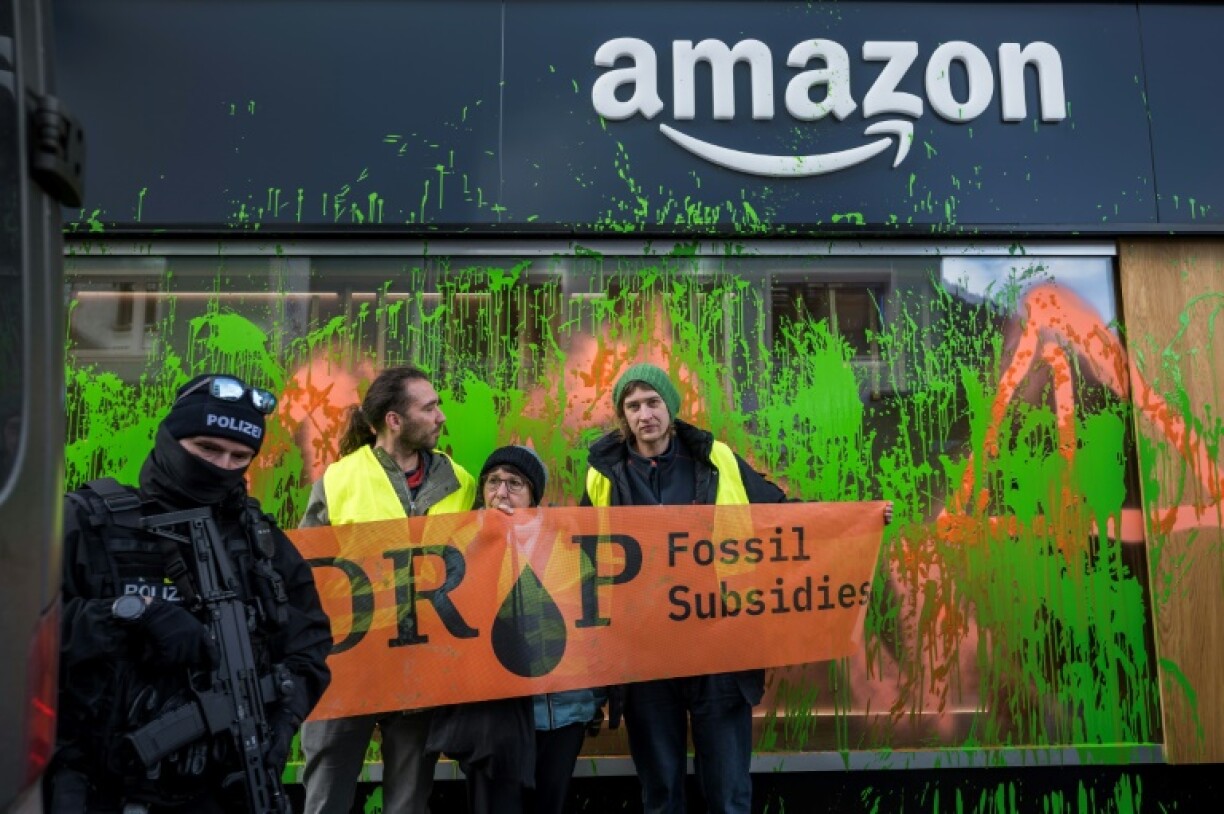 Activists threw paint on the window of an Amazon pavilion in Davos