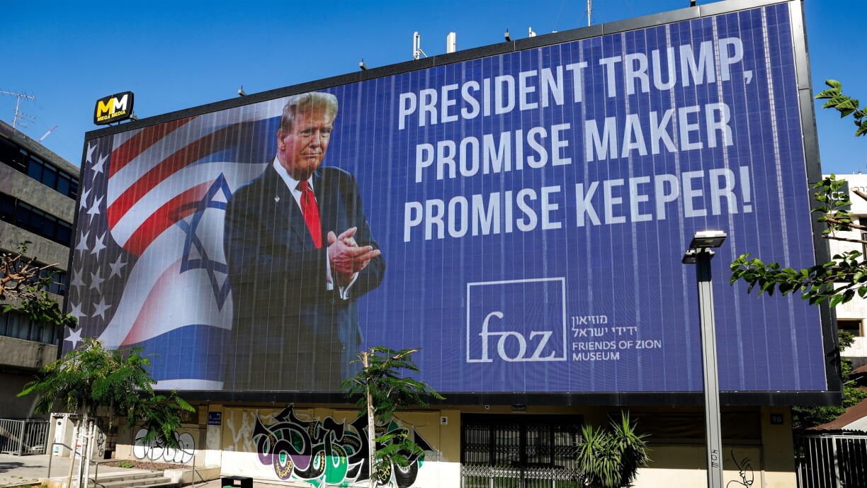 A billboard praising US President Donald Trump by the Friends of Zion Museum is displayed in Tel Aviv on 26 June 2025.