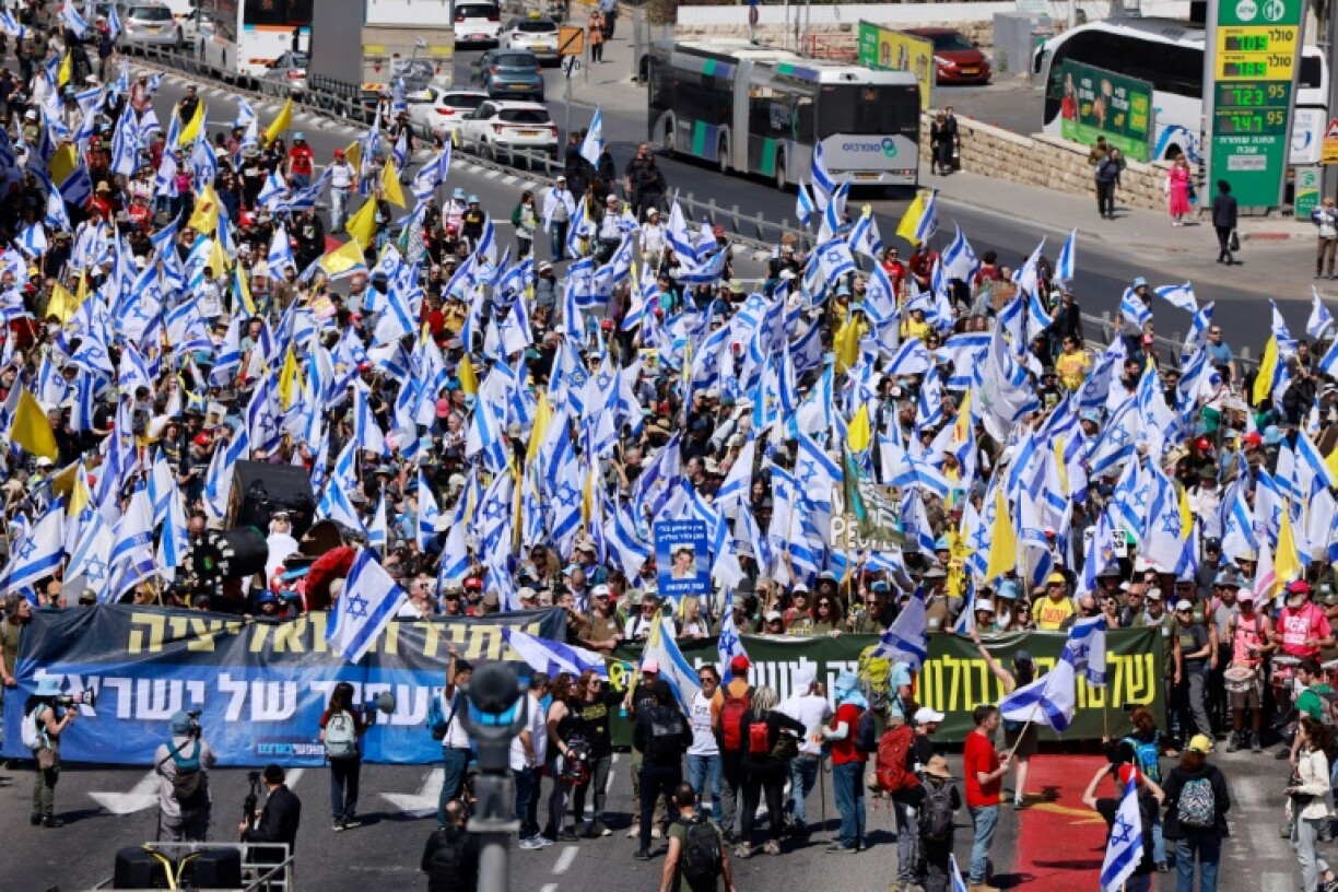 A tense police force manned makeshift barricades around the protest, which grew throughout the day
