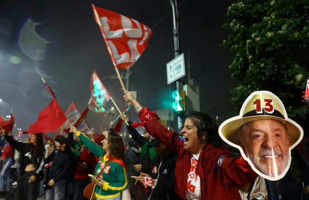 Supporter of Brazil's Luiz Inacio Lula da Silva celebrate after he won a fourth term as president