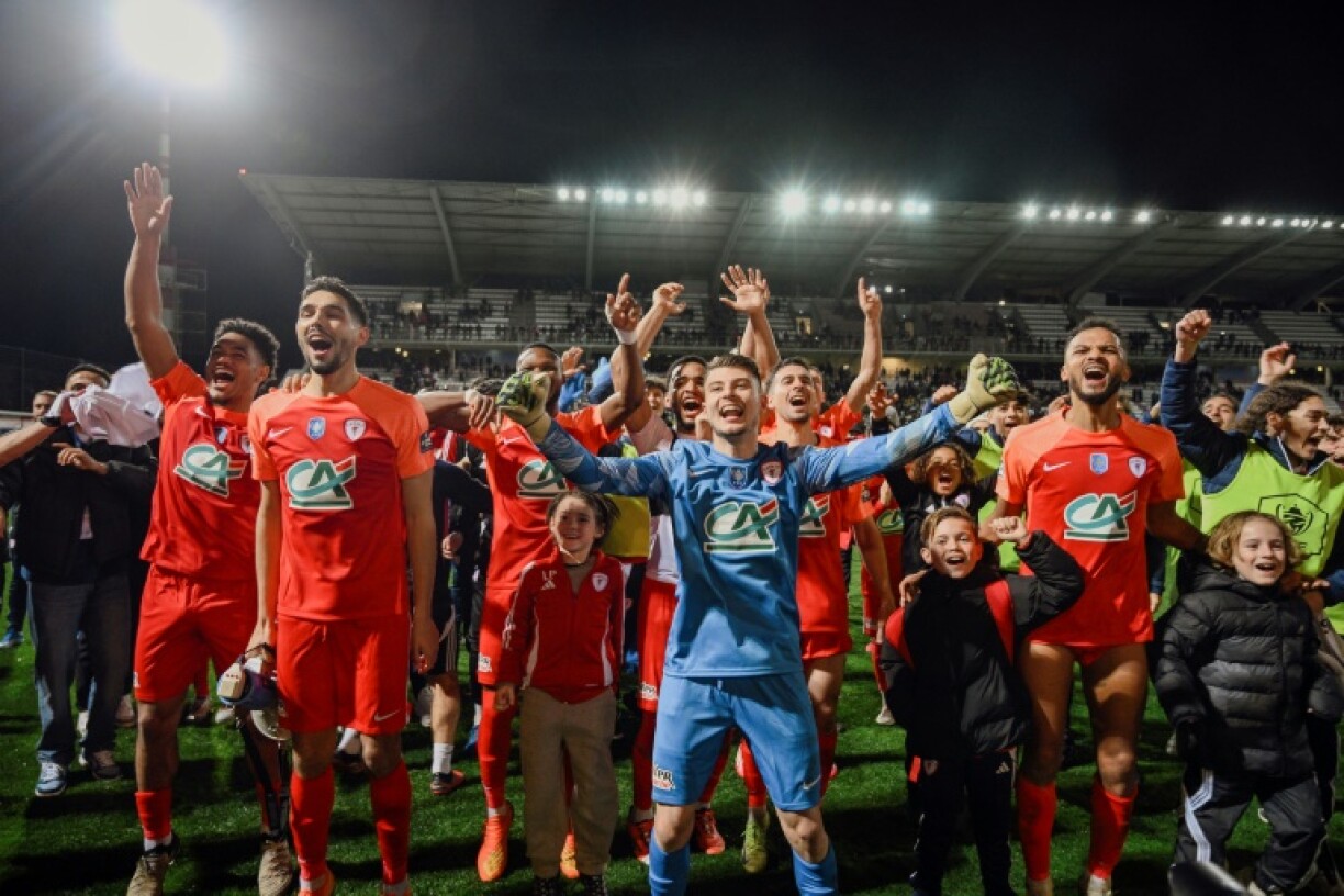Cannes players celebrate after beating Guingamp in the French Cup quarter-finals in February. They host Reims of Ligue 1 in the last four on Wednesday