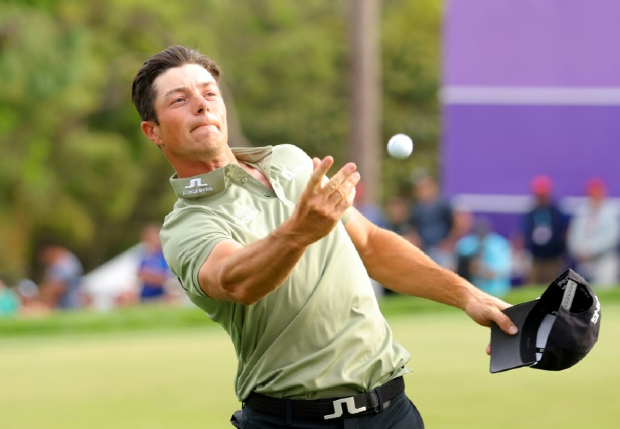 Norway's Viktor Hovland reacts on the 18th green after winning the PGA Tour Valspar Championship