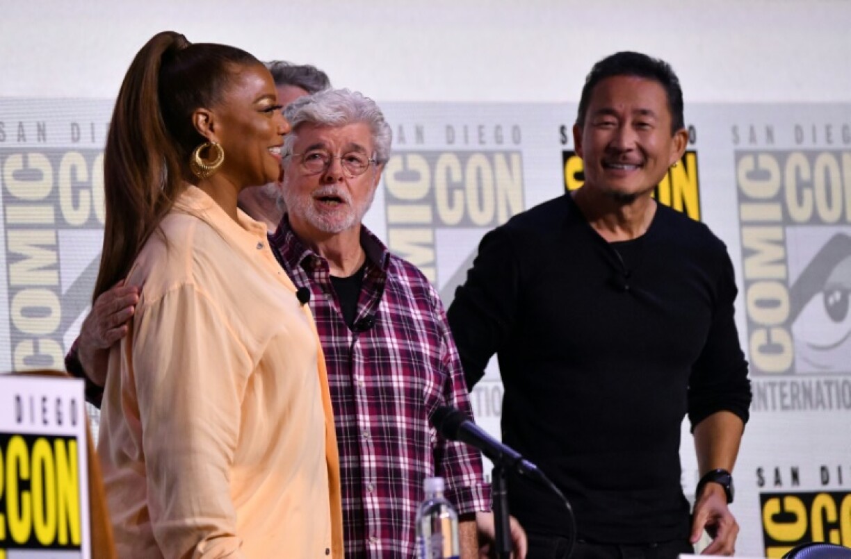 Singer and actress Queen Latifah (left) moderated the panel discussion between director George Lucas (center) and production designer Doug Chiang (right)