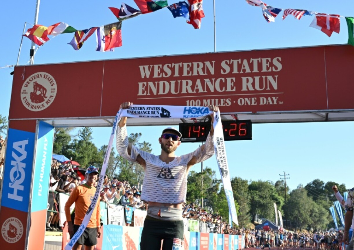 USA's Caleb Olson crosses the finish line to win the 2025 Western States Endurance Run