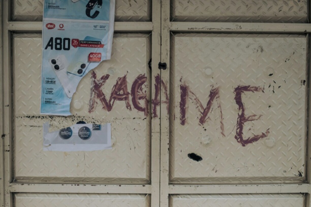 The name of the Rwandan President Paul Kagame written on the door of a looted shop in Goma