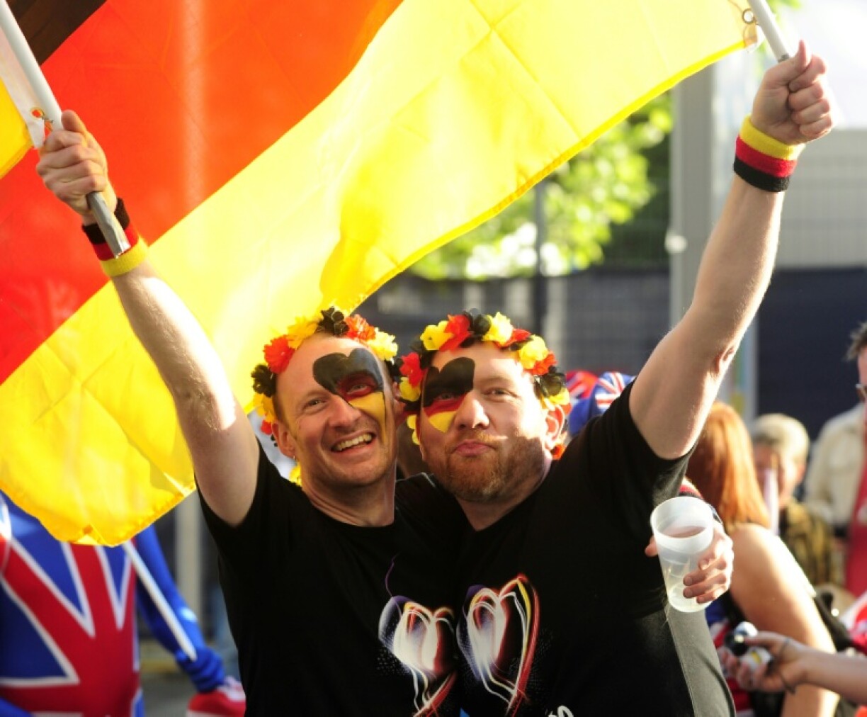 Two Germany supporters cheer at final of the 56th Eurovision in Duesseldorf, Germany, in 2011