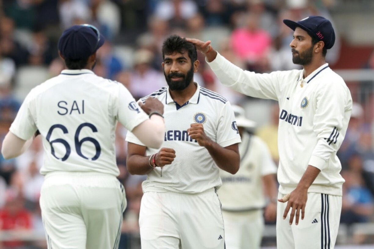 India's Jasprit Bumrah (C) celebrates with Sai Sudharsan (L) and Washington Sundar (R) after dismissing England's Liam Dawson in the fourth Test at Old Trafford