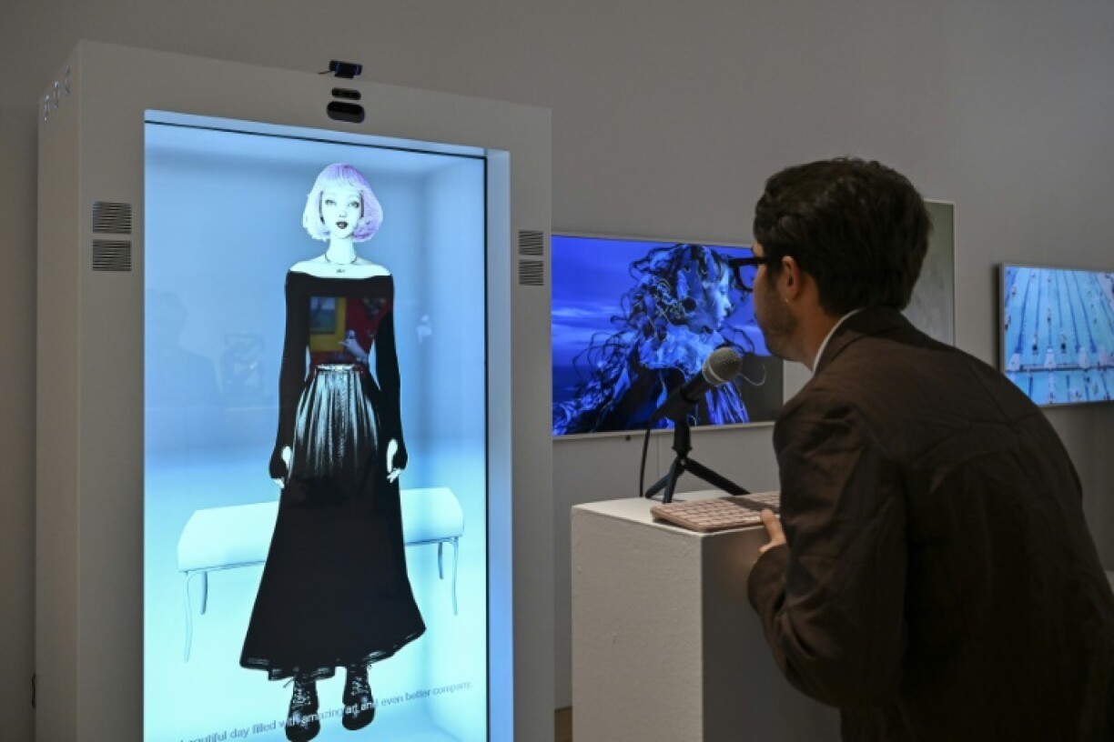 A person interacts with AI artwork created by Claire Silver at a press preview for 'Augmented Intelligence' at Christie’s on February 20, 2025 in New York City