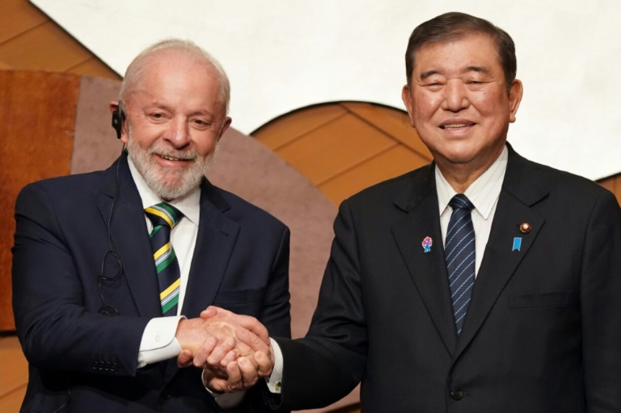 Brazilian President Luiz Inacio Lula da Silva (L) said his country and Japan had ' more to gain from integration than from protectionist practices'