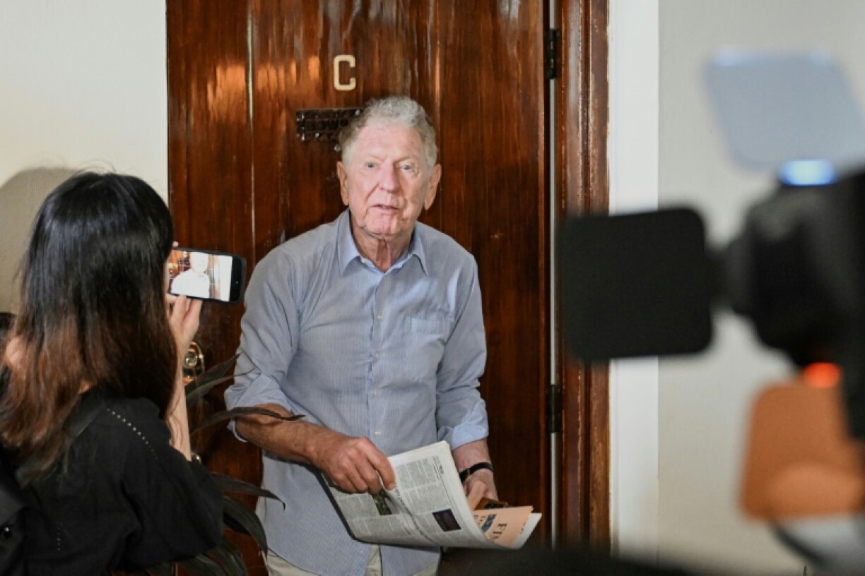 British journalist Philip Bowring, husband of pro-democracy activist Claudia Mo, speaks to the media outside his apartment after his wife arrived home from Lo Wu Correctional Institution, in Hong Kong on April 29, 2025