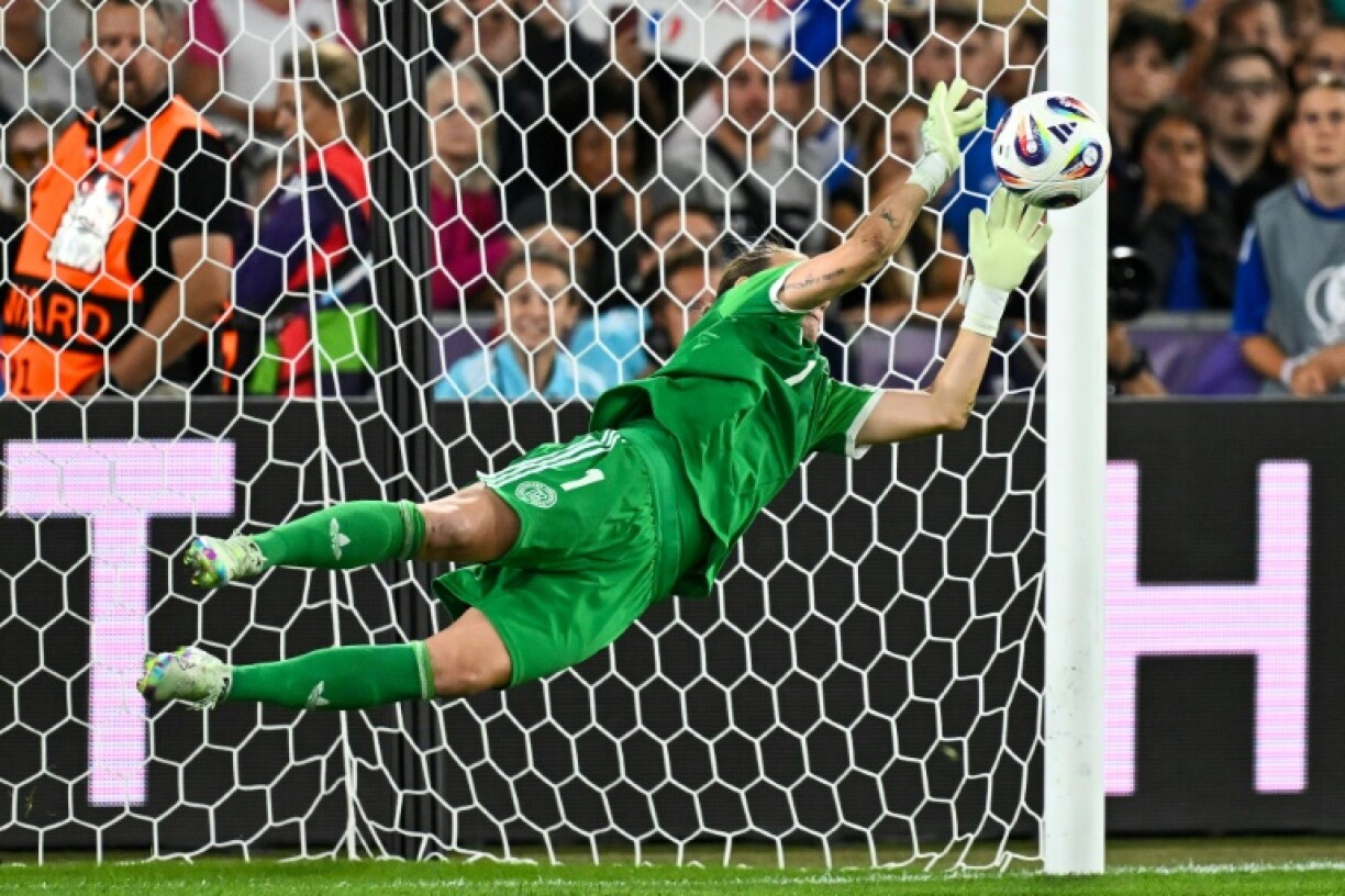 Ann-Katrin Berger stretches to save Alice Sombath's penalty and send Germany to the semi-finals of Women's Euro 2025