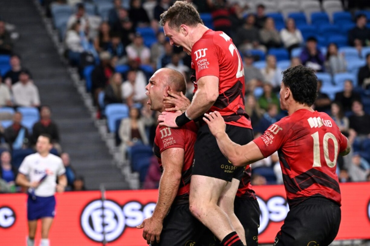 Crusaders' Tom Christie (left) celebrates his try with teammates against New South Wales Waratahs earlier this season