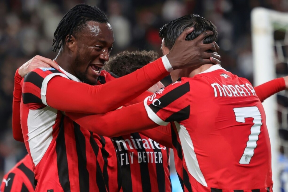 AC Milan's English forward Tammy Abraham celebrates with Spanish forward Alvaro Morata after scoring the winner in the Italian Super Cup final against Inter Milan in Riyadh