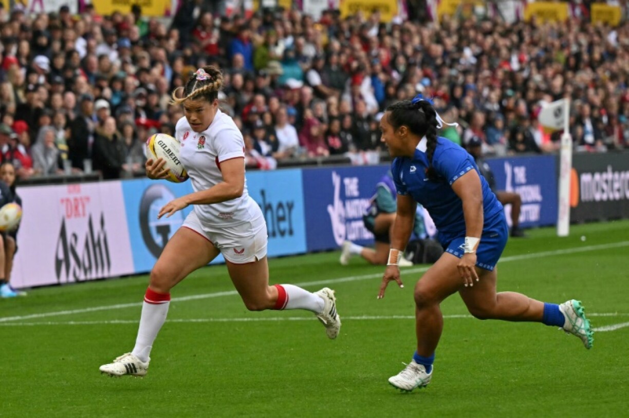 England wing Jess Breach runs in a try during a 92-3 Women's Rugby World Cup Pool A win over Samoa in Northampton